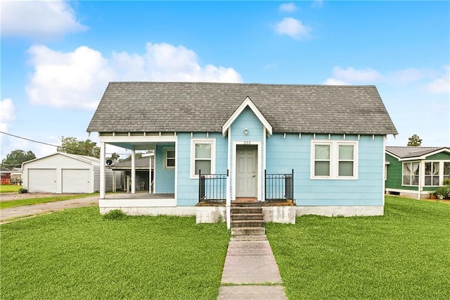 253 Central Ave, Reserve, LA 70084 - bungalow-style house featuring a garage, a front lawn, an outdoor structure, and a porch