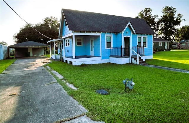 253 Central Ave, Reserve, LA 70084 - view of front facade with a porch, a shingled roof, a front lawn, and driveway