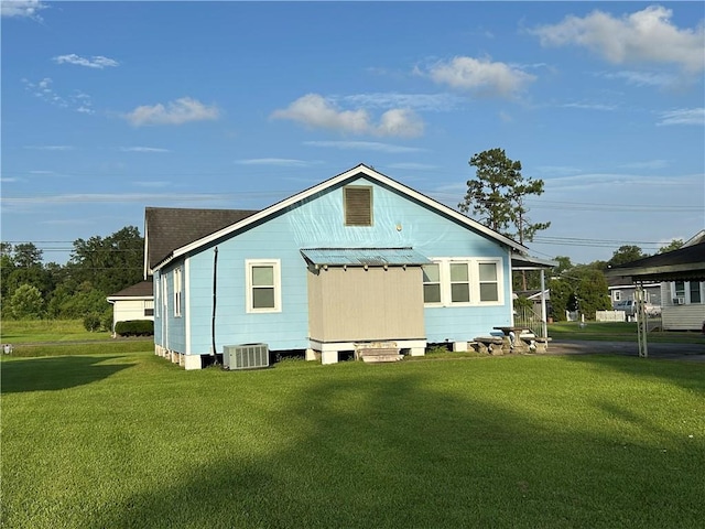 253 Central Ave, Reserve, LA 70084 - back of property featuring a yard, a shingled roof, and a metal roof