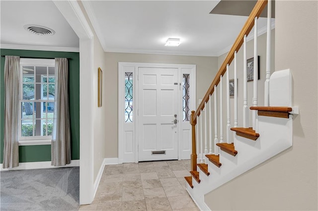 foyer featuring visible vents, stairs, baseboards, and ornamental molding