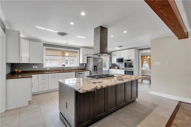 kitchen with visible vents, island exhaust hood, stainless steel appliances, white cabinets, and light tile patterned floors