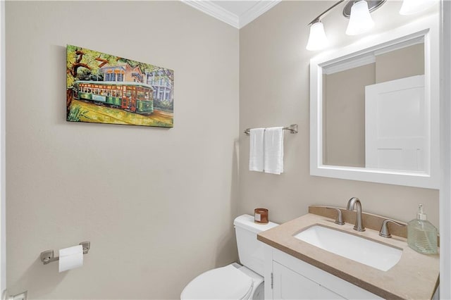 half bathroom with toilet, vanity, and crown molding