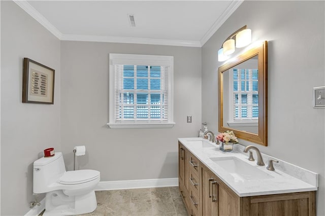 bathroom featuring crown molding, toilet, baseboards, and a sink