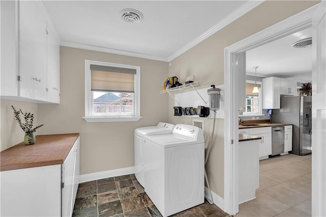 6409 Bertha Dr, New Orleans, LA 70122 - washroom featuring independent washer and dryer, baseboards, crown molding, and cabinet space
