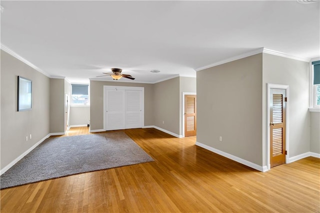 6409 Bertha Dr, New Orleans, LA 70122 - spare room with light wood-style floors, ceiling fan, baseboards, and ornamental molding
