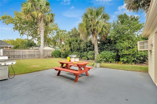 view of patio with grilling area and fence