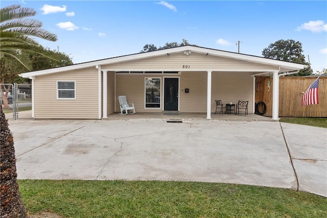 back of house with a patio