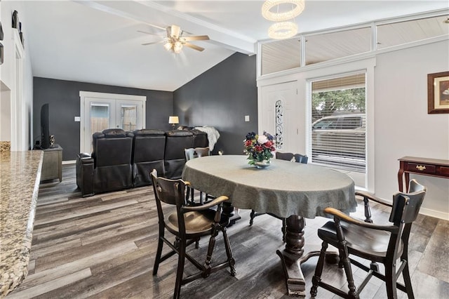 dining area with vaulted ceiling with beams, dark hardwood / wood-style floors, and ceiling fan