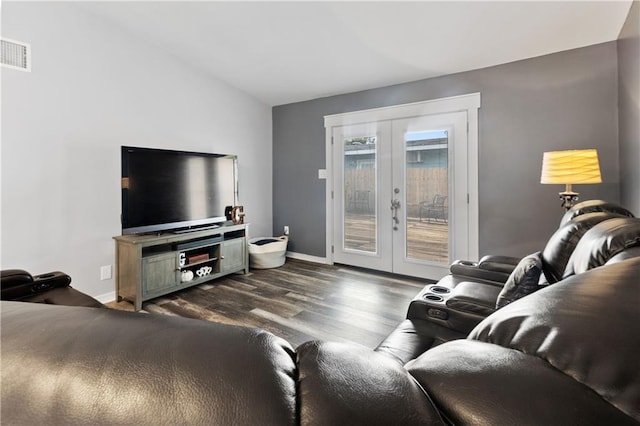 living room with french doors and dark wood-type flooring