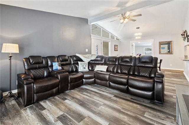 cinema room featuring ceiling fan, lofted ceiling with beams, and wood-type flooring