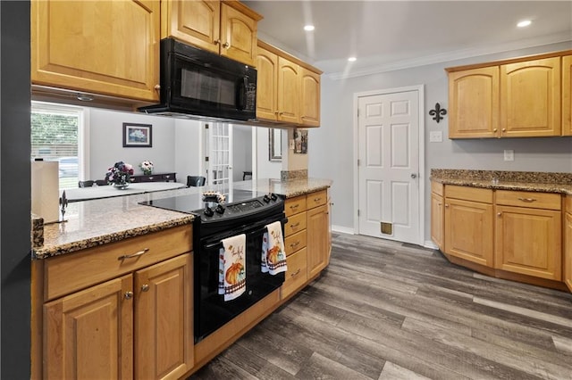 kitchen featuring light stone countertops, crown molding, black appliances, and dark hardwood / wood-style flooring