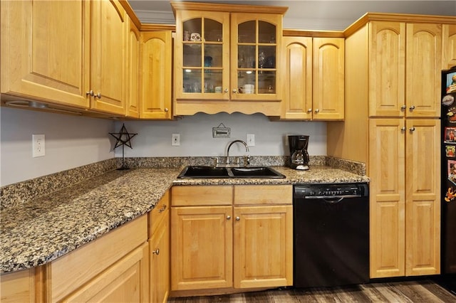 kitchen with dishwasher, sink, dark stone counters, dark wood-type flooring, and light brown cabinets