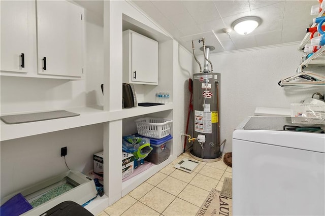 washroom with cabinets, washer / clothes dryer, water heater, light tile patterned flooring, and crown molding