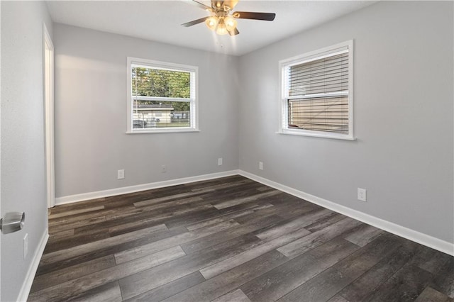 spare room featuring ceiling fan and dark hardwood / wood-style flooring