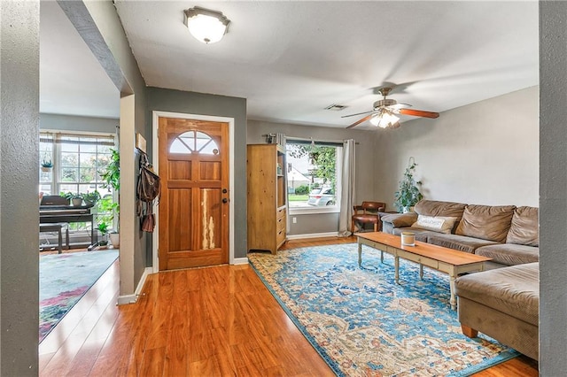 entrance foyer with hardwood / wood-style flooring and ceiling fan