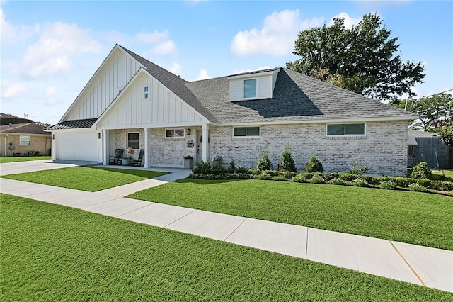 view of front of house featuring a garage and a front lawn