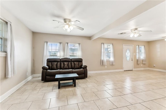 tiled living room with beamed ceiling and ceiling fan