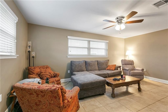 living room with ceiling fan and light tile patterned floors