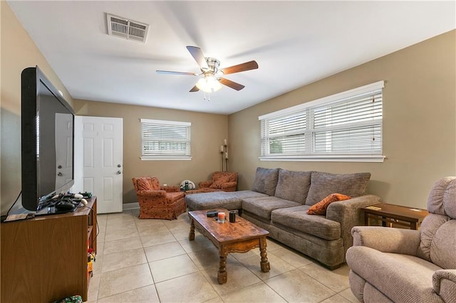 living room with light tile patterned flooring and ceiling fan