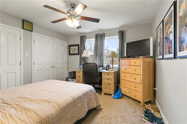 bedroom with light colored carpet and ceiling fan