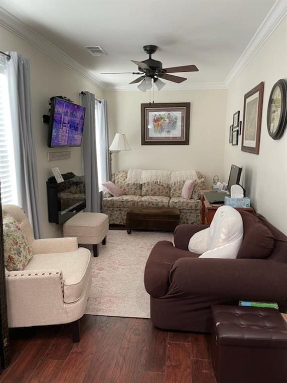 living room featuring ornamental molding, dark hardwood / wood-style floors, and ceiling fan