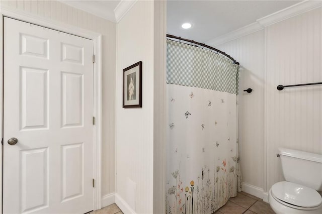 bathroom with toilet, ornamental molding, a shower with curtain, and tile patterned flooring