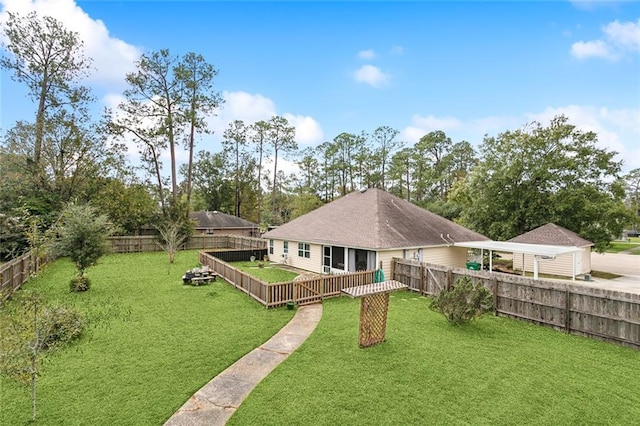 rear view of property with a yard