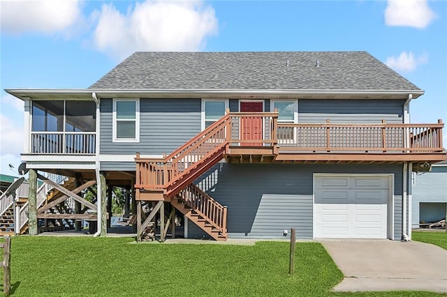 rear view of house featuring stairs, a yard, roof with shingles, and an attached garage