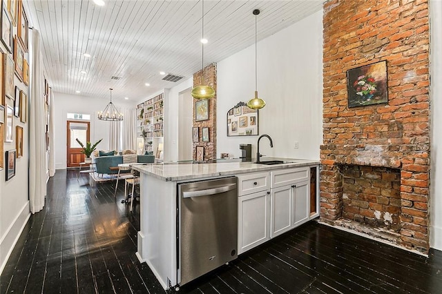 kitchen featuring white cabinets, pendant lighting, light stone counters, sink, and stainless steel dishwasher