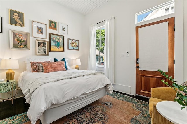 bedroom featuring dark wood-type flooring