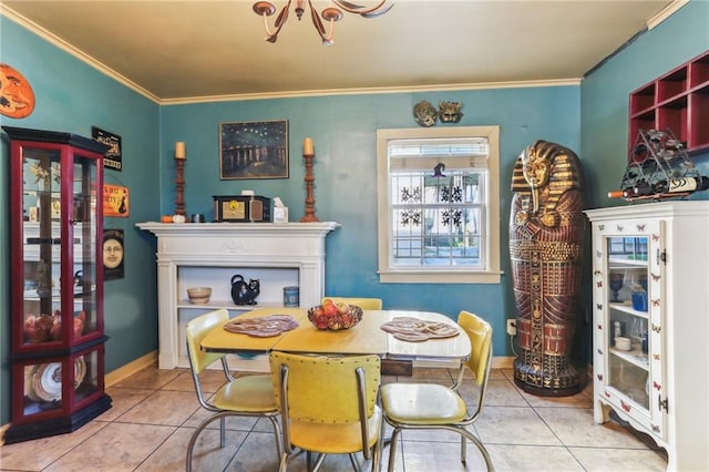 tiled dining room featuring crown molding