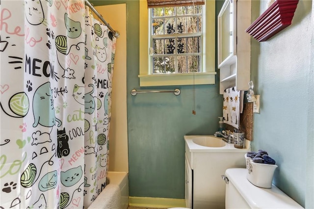 full bathroom with vanity, toilet, and shower / bathtub combination with curtain