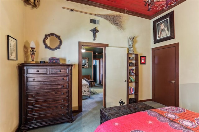 bedroom featuring ornamental molding and carpet floors