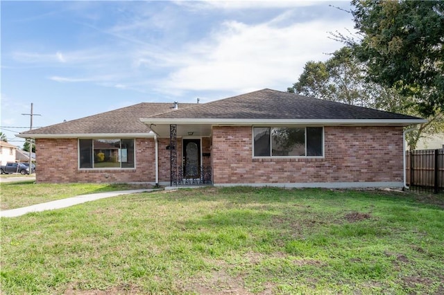 single story home with a front yard