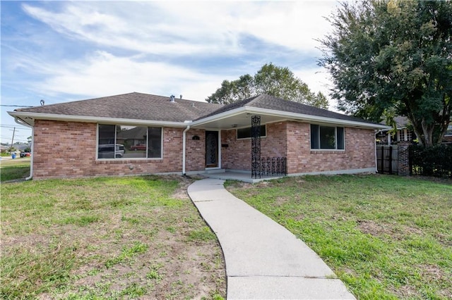 ranch-style home with a front yard