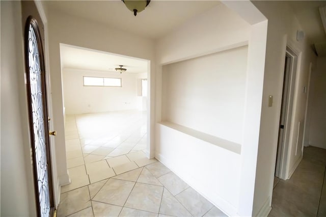 hallway featuring light tile patterned floors