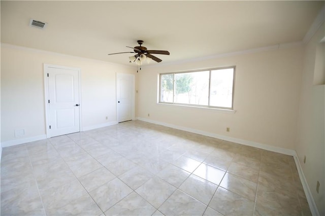 spare room featuring crown molding, light tile patterned floors, and ceiling fan