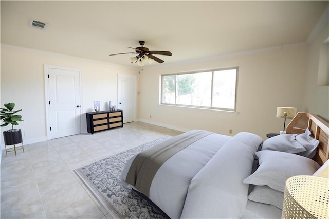 bedroom with ceiling fan, ornamental molding, and light tile patterned flooring