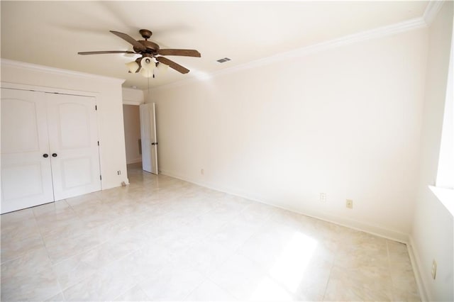 unfurnished bedroom with ornamental molding, a closet, and ceiling fan