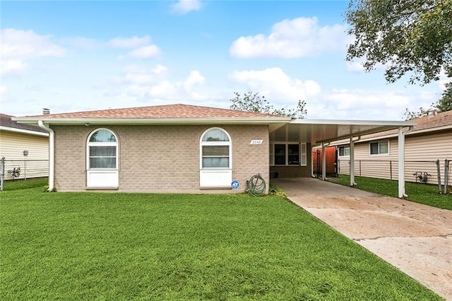 view of front facade with a carport and a front lawn