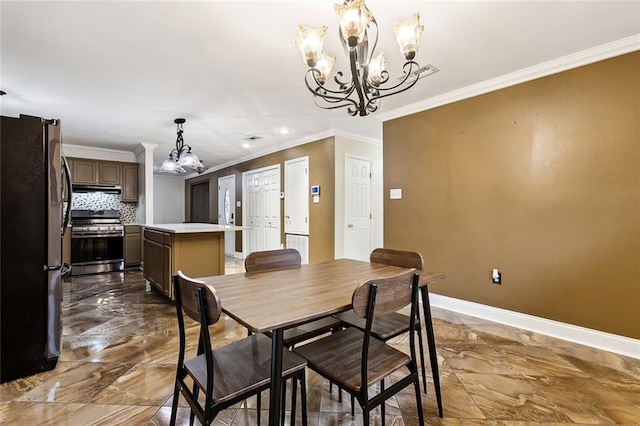 dining room with an inviting chandelier and crown molding