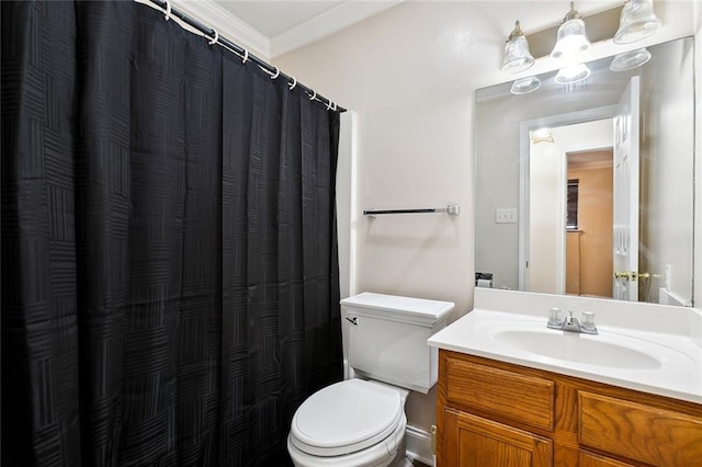 bathroom with ornamental molding, vanity, toilet, and a notable chandelier