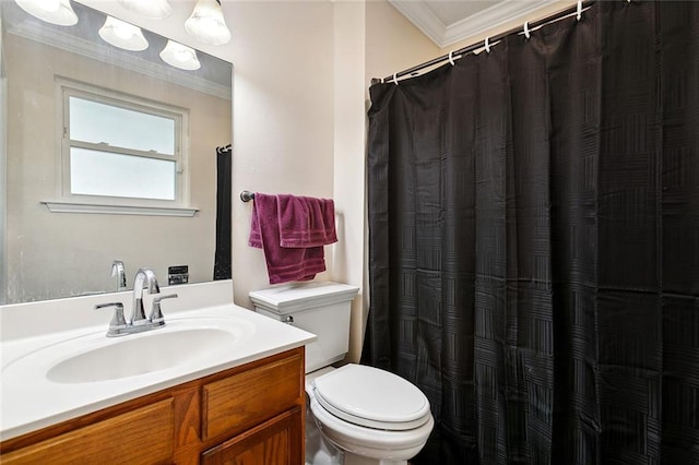 bathroom featuring a shower with shower curtain, vanity, toilet, and crown molding