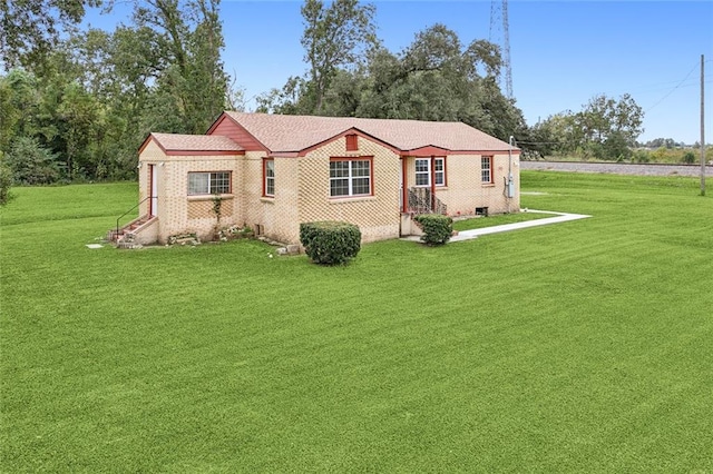 back of house featuring a yard