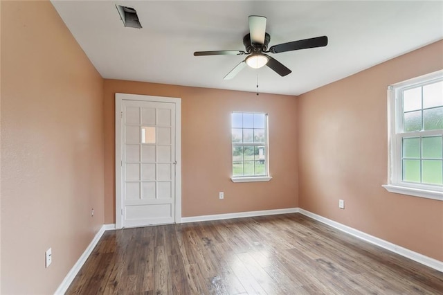 spare room with light wood-type flooring and ceiling fan