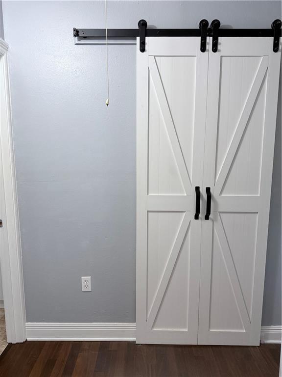 bathroom featuring walk in shower, toilet, ornamental molding, vanity, and tile patterned floors