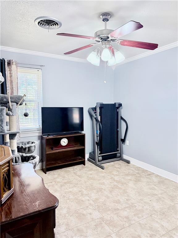 home office with crown molding, light tile patterned floors, and ceiling fan