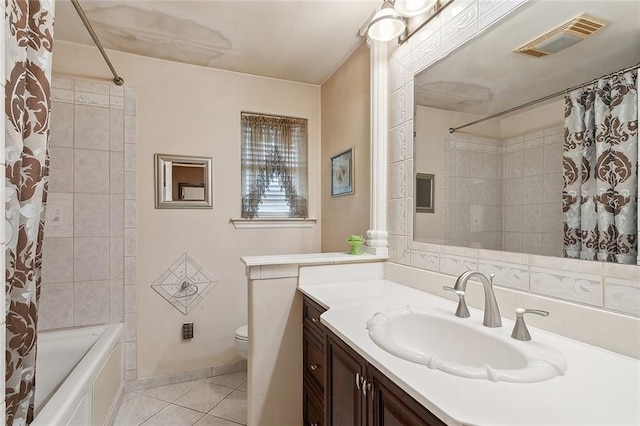 full bathroom featuring vanity, toilet, shower / bathtub combination with curtain, and tile patterned flooring