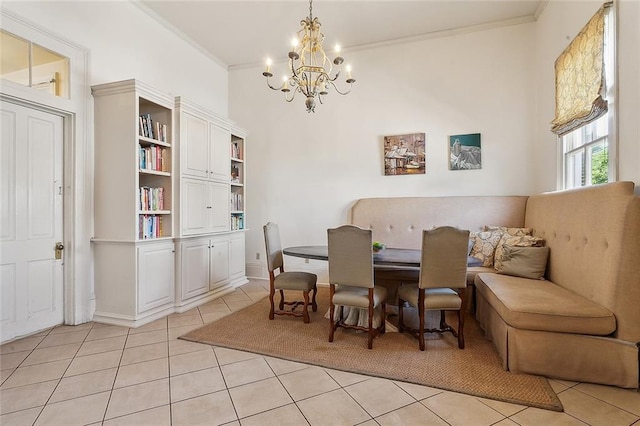 dining room featuring ornamental molding, light tile patterned floors, and a notable chandelier