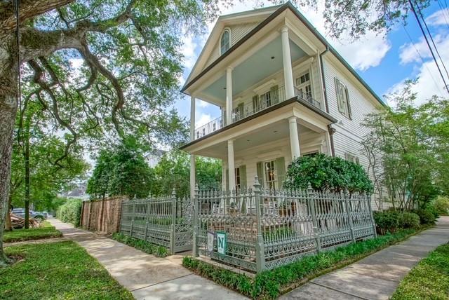 view of side of home with a balcony and covered porch